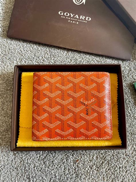 goyard bifold wallet orange.